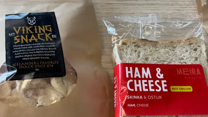 Package of Viking Snack (dried fish) and ham and cheese sandwich.